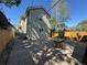 Backyard view with a concrete patio, wood fence and trees for shade, offering a relaxing outdoor space at 3440 W 33Rd Ave, Denver, CO 80211