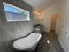 Modern bathroom featuring a soaking tub, double vanity and large window for natural light at 3440 W 33Rd Ave, Denver, CO 80211