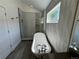 Luxurious bathroom featuring a freestanding tub, a glass-enclosed shower, and stylish gray tile at 3440 W 33Rd Ave, Denver, CO 80211