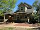 Charming two-story home with a covered porch, landscaped front yard, and inviting curb appeal at 3440 W 33Rd Ave, Denver, CO 80211