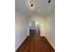 Hallway showcasing wood floors and access to other rooms at 3440 W 33Rd Ave, Denver, CO 80211