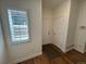 Bright hallway with hardwood floors, white trim, and natural light at 3440 W 33Rd Ave, Denver, CO 80211
