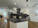 Stylish kitchen with stainless steel appliances, granite countertops, and a convenient breakfast bar at 3440 W 33Rd Ave, Denver, CO 80211