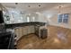 Modern kitchen features granite countertops, stainless steel appliances, and hardwood floors at 3440 W 33Rd Ave, Denver, CO 80211