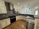 Well-equipped kitchen featuring stainless steel appliances, granite countertops, and stylish cabinetry at 3440 W 33Rd Ave, Denver, CO 80211