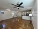 Bright and open living space with hardwood floors, a modern ceiling fan, and ample natural light at 3440 W 33Rd Ave, Denver, CO 80211