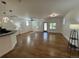 Spacious living room with hardwood floors, bright natural light, and modern light fixtures at 3440 W 33Rd Ave, Denver, CO 80211