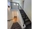 Stairway with modern railing and leading to lower level at 3440 W 33Rd Ave, Denver, CO 80211
