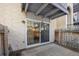 A back patio with sliding glass doors for indoor-outdoor living at 12108 Melody Dr # 103, Denver, CO 80234