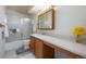 Bathroom with shower over tub, standard vanity, and neutral decor at 12108 Melody Dr # 103, Denver, CO 80234