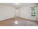 Bright bedroom with neutral carpet and window at 12108 Melody Dr # 103, Denver, CO 80234