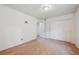 A spacious bedroom with carpeted floors, closet, and adjacent doorway at 12108 Melody Dr # 103, Denver, CO 80234