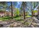 Landscaped green space with mature trees at 12108 Melody Dr # 103, Denver, CO 80234