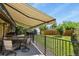 Inviting backyard patio with retractable awning, perfect for outdoor relaxation at 5030 Titan Ct, Denver, CO 80239