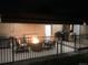 Backyard patio featuring a fire pit, perfect for evening gatherings at 5030 Titan Ct, Denver, CO 80239