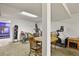 Basement with a sitting area, exercise equipment, and wood furnishings at 5030 Titan Ct, Denver, CO 80239