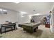 Spacious finished basement with a pool table and potential for various activities at 5030 Titan Ct, Denver, CO 80239