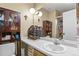 Neutral toned bathroom with a vanity, large mirror, and a glass-enclosed shower at 5030 Titan Ct, Denver, CO 80239