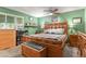 Cozy bedroom featuring a wooden bed frame, a ceiling fan, and a window with natural light at 5030 Titan Ct, Denver, CO 80239
