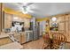 Eat-in kitchen with stainless steel refrigerator, microwave and dishwasher, plus light wood cabinets and countertops at 5030 Titan Ct, Denver, CO 80239