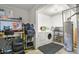 Utility space featuring a washing machine, workbench, tools, and water heater at 5030 Titan Ct, Denver, CO 80239