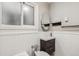 Bathroom with modern sink, white tile walls, and updated fixtures at 1416 N Downing St # 1, Denver, CO 80218