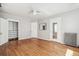 Bright bedroom features hardwood floors, a ceiling fan and a closet with installed shelving for optimal storage at 1416 N Downing St # 1, Denver, CO 80218