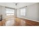 Cozy bedroom bathed in sunlight features hardwood floors, and a ceiling fan for comfort at 1416 N Downing St # 1, Denver, CO 80218