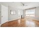 Light bedroom with hardwood floors, closet doors, and vintage radiator at 1416 N Downing St # 1, Denver, CO 80218