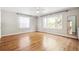 Bright bedroom with hardwood floors, updated windows, and ceiling fan fixture at 1416 N Downing St # 1, Denver, CO 80218