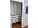 Organized closet featuring shelves, hanging rods, and drawer storage at 1416 N Downing St # 1, Denver, CO 80218