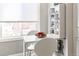Bright dining area with a white table, chairs, shelving and view from the window at 1416 N Downing St # 1, Denver, CO 80218