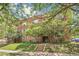 Charming brick apartment building with mature trees and landscaping at 1416 N Downing St # 1, Denver, CO 80218