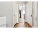 Hallway with hardwood flooring that leads to the kitchen at 1416 N Downing St # 1, Denver, CO 80218