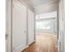 Hallway with hardwood floors leading to the bedroom with lots of natural light at 1416 N Downing St # 1, Denver, CO 80218