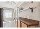 Well lit kitchen featuring granite countertops, open shelving, and tile flooring at 1416 N Downing St # 1, Denver, CO 80218