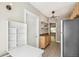 Kitchen featuring a fold-down table, open shelving, granite countertops, and stainless steel appliances at 1416 N Downing St # 1, Denver, CO 80218