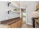 Kitchen featuring granite countertops, open shelving, and stainless steel appliances at 1416 N Downing St # 1, Denver, CO 80218