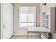 Room with neutral colors, window with white blinds, fold down table, and ceramic tile flooring at 1416 N Downing St # 1, Denver, CO 80218