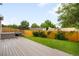 Inviting backyard with a spacious deck and lush green lawn at 4127 S Lewiston Cir, Aurora, CO 80013