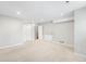 Bright basement featuring neutral carpet, recessed lighting, and access to other areas of the home at 4127 S Lewiston Cir, Aurora, CO 80013