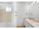 A bathroom featuring a tub and shower combo with a dual sink vanity at 4127 S Lewiston Cir, Aurora, CO 80013
