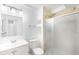 Modern bathroom with a glass shower door, sleek vanity, and neutral tile at 4127 S Lewiston Cir, Aurora, CO 80013
