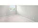 Bedroom featuring neutral carpet and a window providing natural light at 4127 S Lewiston Cir, Aurora, CO 80013