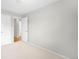 Bright bedroom featuring neutral carpet and fresh gray paint at 4127 S Lewiston Cir, Aurora, CO 80013