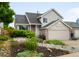 Inviting two-story home with well-kept landscaping, a two-car garage, and beautiful curb appeal at 4127 S Lewiston Cir, Aurora, CO 80013