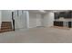 Unfinished basement space with staircase and wet bar area at 461 Muirfield Cir, Louisville, CO 80027
