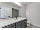 Modern bathroom featuring quartz counters and a tiled shower/tub at 461 Muirfield Cir, Louisville, CO 80027