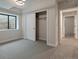 This bedroom features a closet, carpeted floor, and bright lighting at 461 Muirfield Cir, Louisville, CO 80027