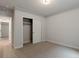 Bedroom with carpet and a closet with sliding doors at 461 Muirfield Cir, Louisville, CO 80027